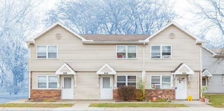 Elmdale Court, tan duplex with 2 stories and 3 entrances