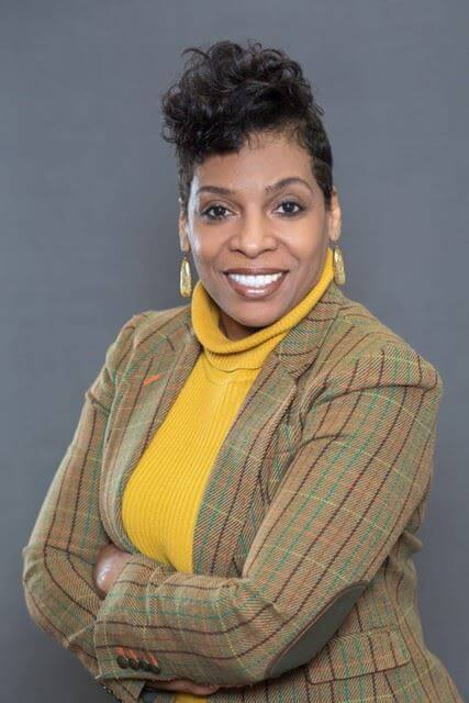 Demetria Simpson portrait  chest up smiling at camera