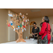 A wooden tree with objects on it