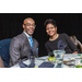 Two guests sitting at a table smiling