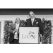 Black and white picture of two men behind the podium