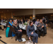 A table of guests enjoying the presentation