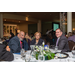 Two men and a woman enjoying a conversation