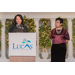 Two women at the podium giving a speech at the Lucas Metropolitan Housing Authority 85 Years Banquet