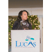 Woman giving a speech at the Lucas Metropolitan Housing Authority 85 Years Banquet