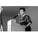 black and white image of a woman giving a speech at the Lucas Metropolitan Housing Authority 85 Years Banquet