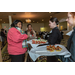 Guests being served food from waitresses