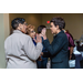 A discussion taking place between three women