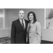 A black and white filter of a man and woman smiling for a picture