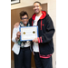 man and woman standing smiling with certificate