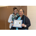 2 women standing with certificate