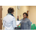 woman in gray being sworn in by woman CEO