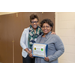 2 women smiling and holding certificate