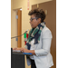 CEO woman in white talking at podium