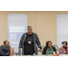 man standing at table speaking