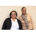 2 women standing smiling at event